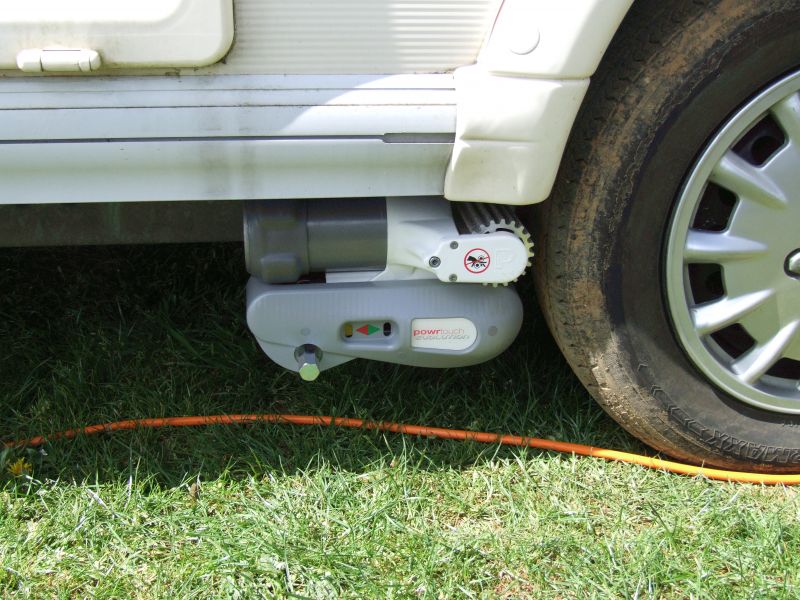 Motor mover fitted in front of nearside caravan wheel